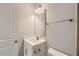 Small bathroom with white vanity, single sink, and a mirror at 604 Emerald Bay Cir, Raleigh, NC 27610