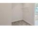 Walk-in closet with wire shelving and carpet flooring at 604 Emerald Bay Cir, Raleigh, NC 27610