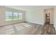 Bright and airy living room with hardwood floors and large windows at 604 Emerald Bay Cir, Raleigh, NC 27610