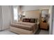 Bedroom with striped bedding and wood nightstands at 605 Emerald Bay Cir, Raleigh, NC 27610
