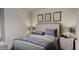 Bedroom with tufted headboard and blue bedding at 605 Emerald Bay Cir, Raleigh, NC 27610