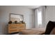 Bedroom with dresser, large mirror, and bed at 605 Emerald Bay Cir, Raleigh, NC 27610