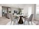 Round dining table with four chairs, in an open concept layout at 605 Emerald Bay Cir, Raleigh, NC 27610