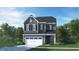 Two-story house with gray siding, white garage door, and landscaping at 605 Emerald Bay Cir, Raleigh, NC 27610