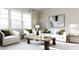 Living room with white sofa, two armchairs, and coffee table at 605 Emerald Bay Cir, Raleigh, NC 27610