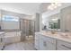 Elegant bathroom with soaking tub, walk-in shower, and double vanity at 609 Emerald Bay Cir, Raleigh, NC 27610