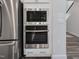 Stainless steel built-in oven and microwave in a modern kitchen at 609 Emerald Bay Cir, Raleigh, NC 27610