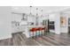Modern kitchen with white cabinets, stainless steel appliances, and an island at 609 Emerald Bay Cir, Raleigh, NC 27610