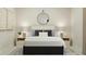 Well-lit bedroom with a bed, nightstands, and modern decor at 612 Emerald Bay Cir, Raleigh, NC 27610