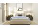 Serene bedroom with a bed, nightstands, and calming wall art at 612 Emerald Bay Cir, Raleigh, NC 27610