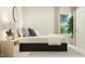 Modern bedroom with a comfortable bed and large window at 612 Emerald Bay Cir, Raleigh, NC 27610