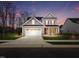 Two-story house with gray siding, white garage door, and landscaped lawn at 612 Emerald Bay Cir, Raleigh, NC 27610