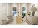 Home office with a desk, two chairs, and large windows at 612 Emerald Bay Cir, Raleigh, NC 27610