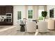 Living room with sectional sofa, two armchairs, and a coffee table at 612 Emerald Bay Cir, Raleigh, NC 27610