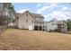 Back of house showing two-story home with deck and yard at 65 Sundew Ct, Clayton, NC 27527