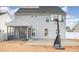 Home features a large backyard with patio, basketball court, and screened porch at 79 Stallion Way, Benson, NC 27504
