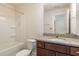 Clean bathroom with granite countertop, tub shower combo and toilet at 79 Stallion Way, Benson, NC 27504
