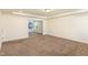 Bright bedroom with neutral carpeting and access to another room at 79 Stallion Way, Benson, NC 27504