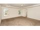 Spacious bedroom with neutral carpeting and ample natural light at 79 Stallion Way, Benson, NC 27504