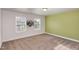 Well-lit bedroom with neutral walls and carpet flooring at 79 Stallion Way, Benson, NC 27504