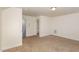 Spacious bonus room with carpet flooring and access to bathroom and stairs at 79 Stallion Way, Benson, NC 27504