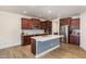 Eat-in kitchen with stainless steel appliances and hardwood floors at 79 Stallion Way, Benson, NC 27504