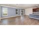 Open living room and kitchen area with hardwood floors at 79 Stallion Way, Benson, NC 27504