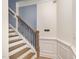 Elegant staircase with wrought iron balusters and hardwood steps at 79 Stallion Way, Benson, NC 27504
