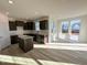 Kitchen with dark brown cabinets, granite countertops, and an island at 981 Channel Drop Lp, Zebulon, NC 27597