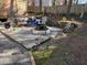 Relaxing backyard patio with fire pit, hot tub, and gravel landscaping at 106 London Plain Ct, Cary, NC 27513