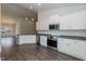 Open kitchen boasting stainless steel appliances and ample white cabinetry at 152 Northwood Dr, Fuquay Varina, NC 27526