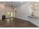 Spacious living room featuring hardwood floors, fireplace and high ceilings at 152 Northwood Dr, Fuquay Varina, NC 27526
