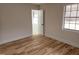 Well-lit bedroom with hardwood floors and two windows at 1815 Bethlehem Rd, Rocky Mount, NC 27803