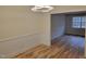 Bright dining room features hardwood floors and an open doorway to another room at 1815 Bethlehem Rd, Rocky Mount, NC 27803