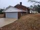 Attached garage with gray door at 1815 Bethlehem Rd, Rocky Mount, NC 27803