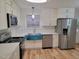 Updated kitchen boasts stainless steel appliances and white cabinetry at 1815 Bethlehem Rd, Rocky Mount, NC 27803