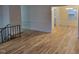 Open concept living room with hardwood floors and views to the dining room at 1815 Bethlehem Rd, Rocky Mount, NC 27803