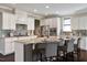 Spacious kitchen with granite island and white cabinets at 2526 Snowdrop Ct, Apex, NC 27502