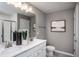 Double vanity bathroom with a large mirror and shower at 391 Fosterton Cottage Way, Raleigh, NC 27603