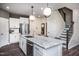 Modern kitchen with white cabinets, granite countertops, and island at 391 Fosterton Cottage Way, Raleigh, NC 27603