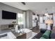 Open living room features a modern kitchen and spacious layout at 391 Fosterton Cottage Way, Raleigh, NC 27603