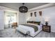 Spacious main bedroom with large windows and en-suite bathroom at 391 Fosterton Cottage Way, Raleigh, NC 27603