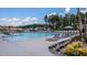 Inviting community pool with plenty of lounge chairs and umbrellas at 393 Fosterton Cottage Way, Raleigh, NC 27603