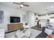 Open concept living room with adjacent kitchen and ample natural light at 393 Fosterton Cottage Way, Raleigh, NC 27603