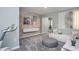Bright recreation room with wood wall accents, exercise equipment, and comfortable seating at 393 Fosterton Cottage Way, Raleigh, NC 27603