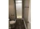 Bathroom with shower stall and wood-look floors at 4600 Millstone Dr # D, Raleigh, NC 27604