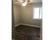 Bedroom with ceiling fan and window at 4600 Millstone Dr # D, Raleigh, NC 27604