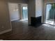 Living room features a fireplace and sliding glass doors to a patio at 4600 Millstone Dr # D, Raleigh, NC 27604