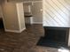 Open living area with wood-look floors and view into kitchen at 4600 Millstone Dr # D, Raleigh, NC 27604