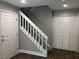 Stairwell with white railing and storage at 4600 Millstone Dr # D, Raleigh, NC 27604